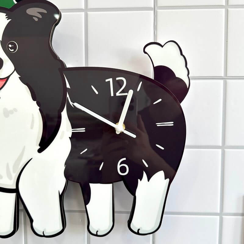 Close-up of Border Collie clock body showing the black clock face and white clock hands