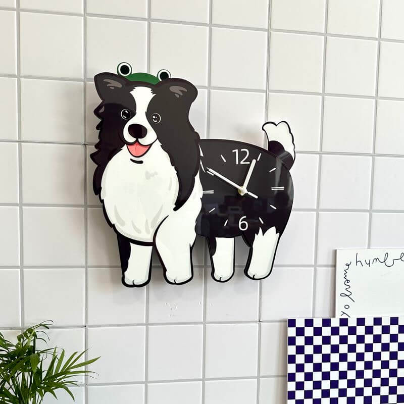 Border Collie clock on white tiled wall next to checkered decor and handwritten sign