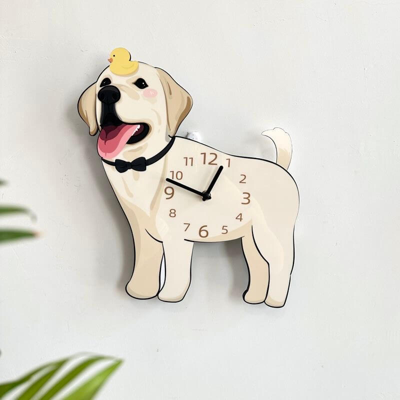 Labrador dog-shaped wall clock mounted on a clean white wall with green plant leaves