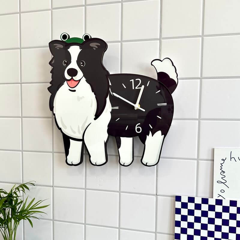 Border Collie wall clock hanging on white square tiles with green plant and checkered decor