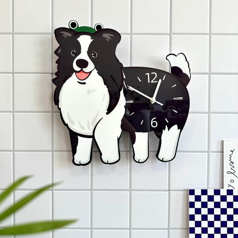 Border Collie dog clock on a clean white tiled wall with blue checkered accent