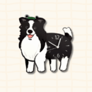 Happy Border Collie dog-shaped wall clock wearing a green frog hat, black and white cartoon design on beige grid background