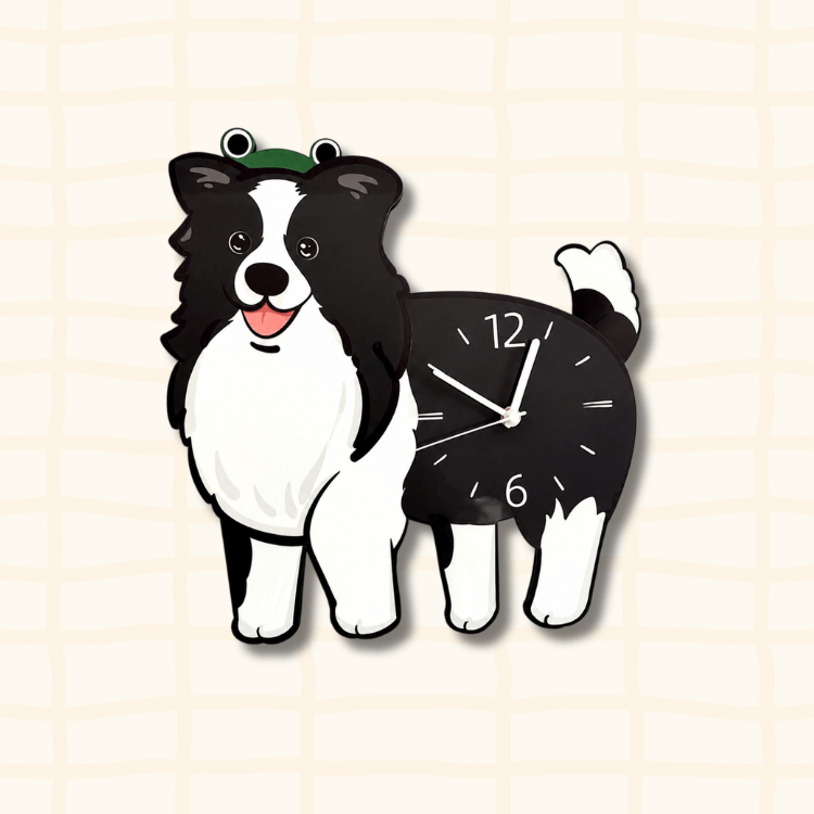 Happy Border Collie dog-shaped wall clock wearing a green frog hat, black and white cartoon design on beige grid background