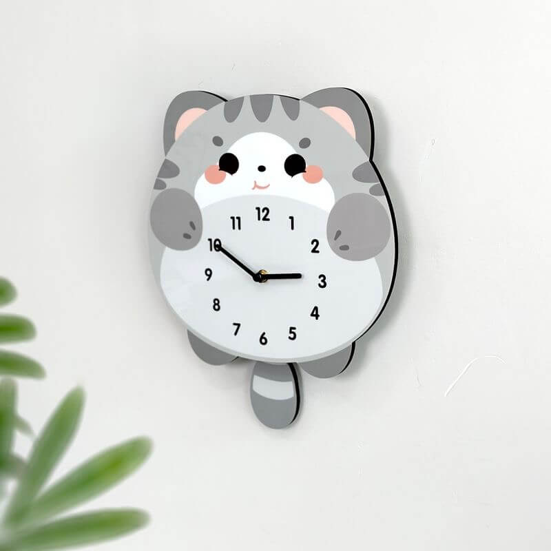 British Shorthair blue cat wall clock angled view showing pink blush cheeks