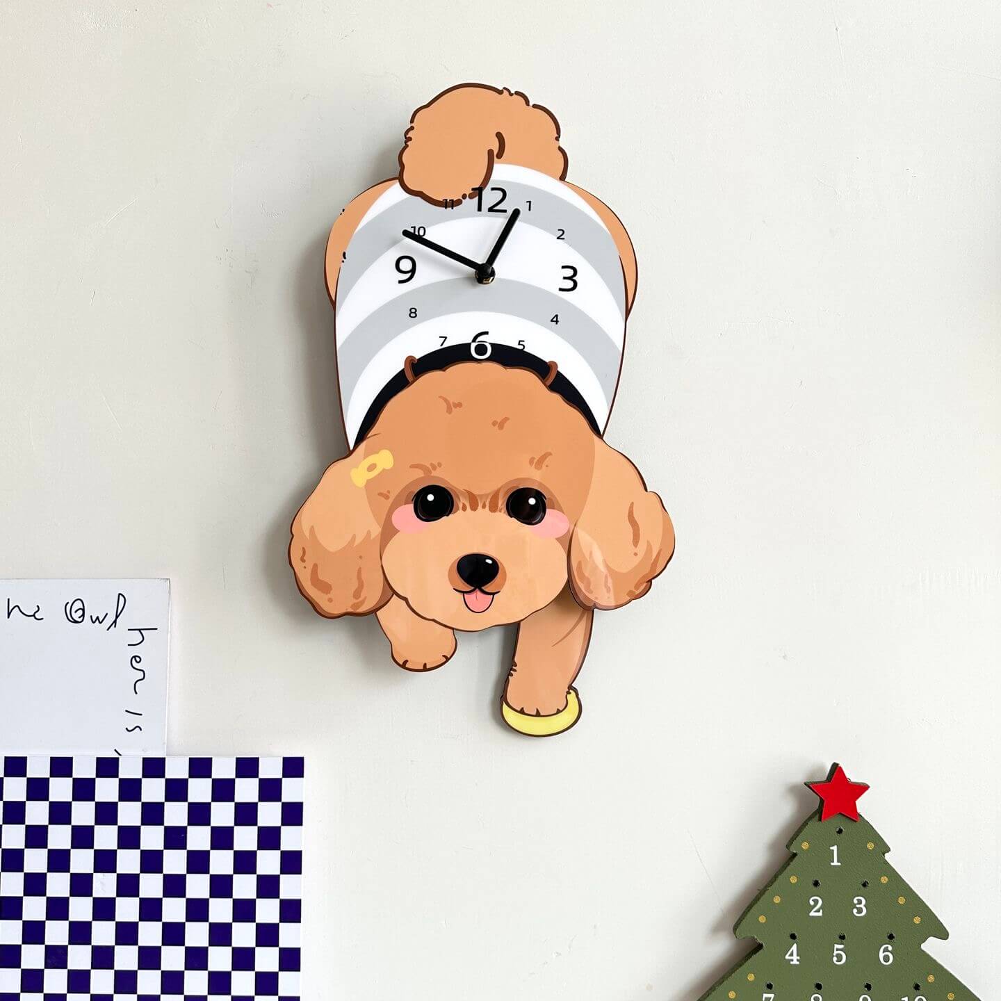 Brown Poodle lying wall clock in room setting with plant and decorative items