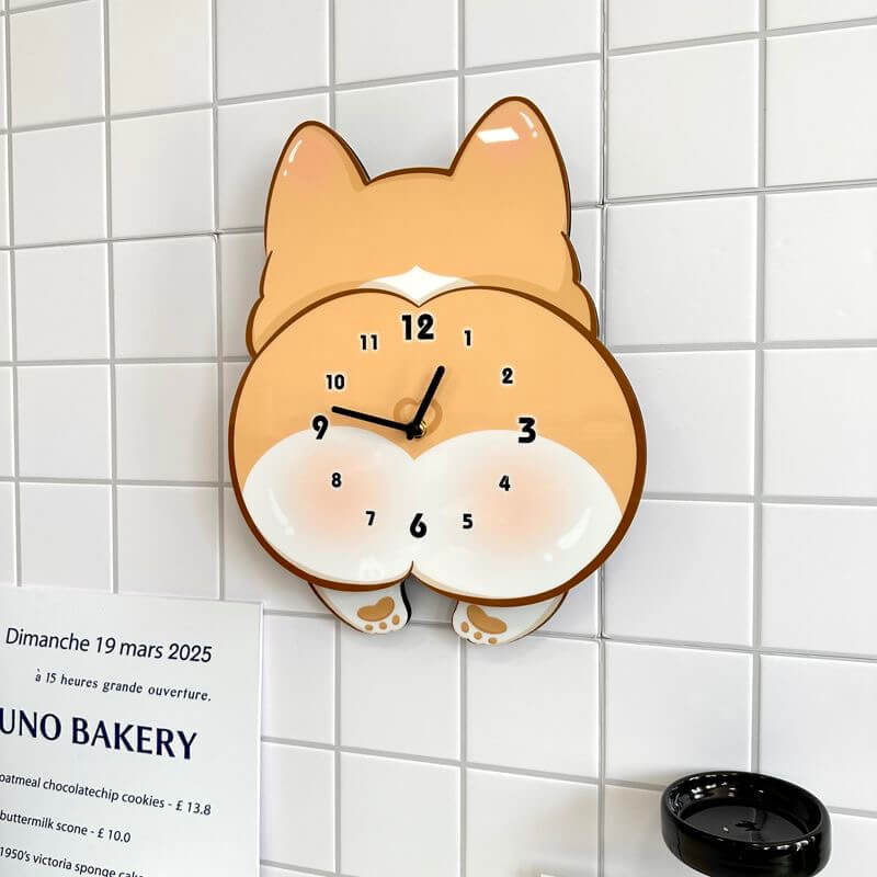 Corgi butt wall clock in room setting with plant and decorative items