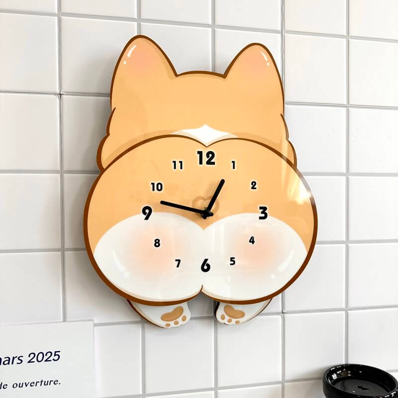 Corgi butt wall clock mounted on clean white wall with green plant decor