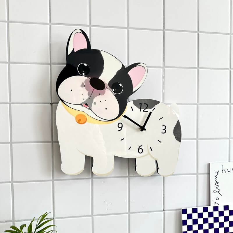 French Bulldog clock on white wall with green plant and home decor items