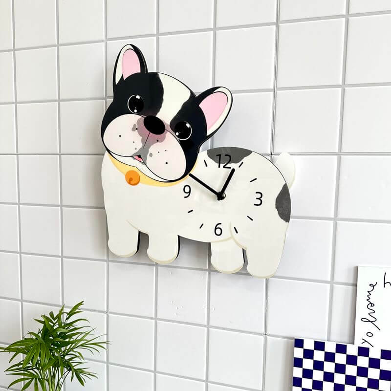 French Bulldog wall clock mounted on clean white wall with green plant decor