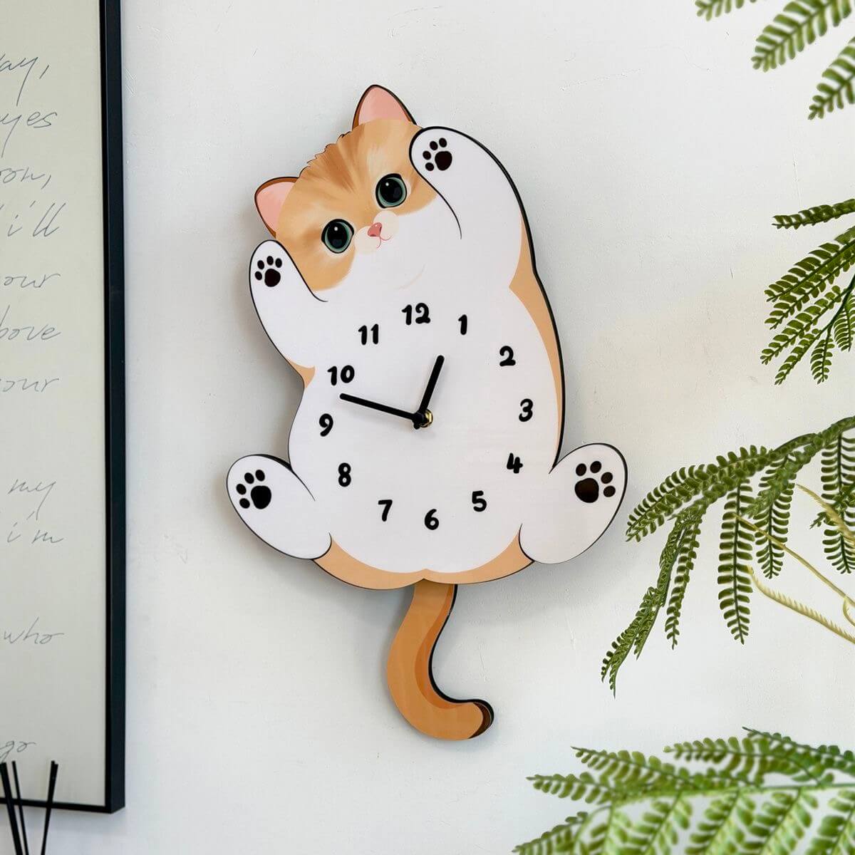 Orange tabby cat clock close-up showing adorable face and paw details