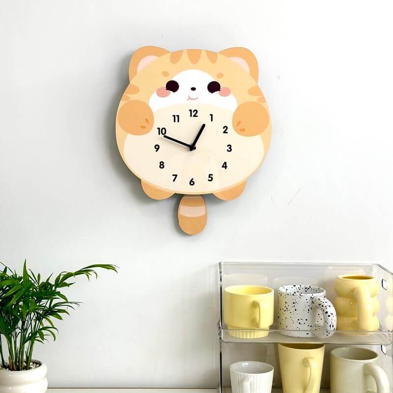 Orange tabby lying cat clock close-up showing adorable face and pink blush