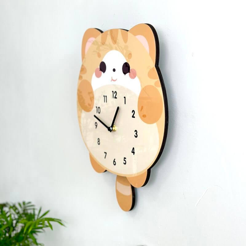 Orange tabby lying cat wall clock in room setting with plant and decorative items