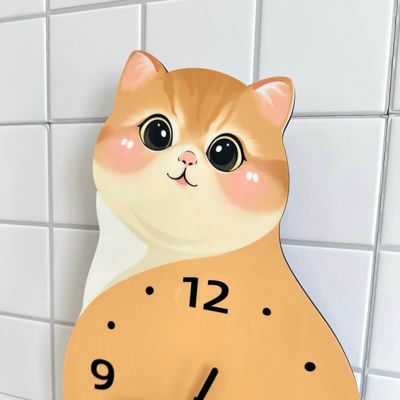 Orange tabby sitting cat clock front view on white wall with green plant