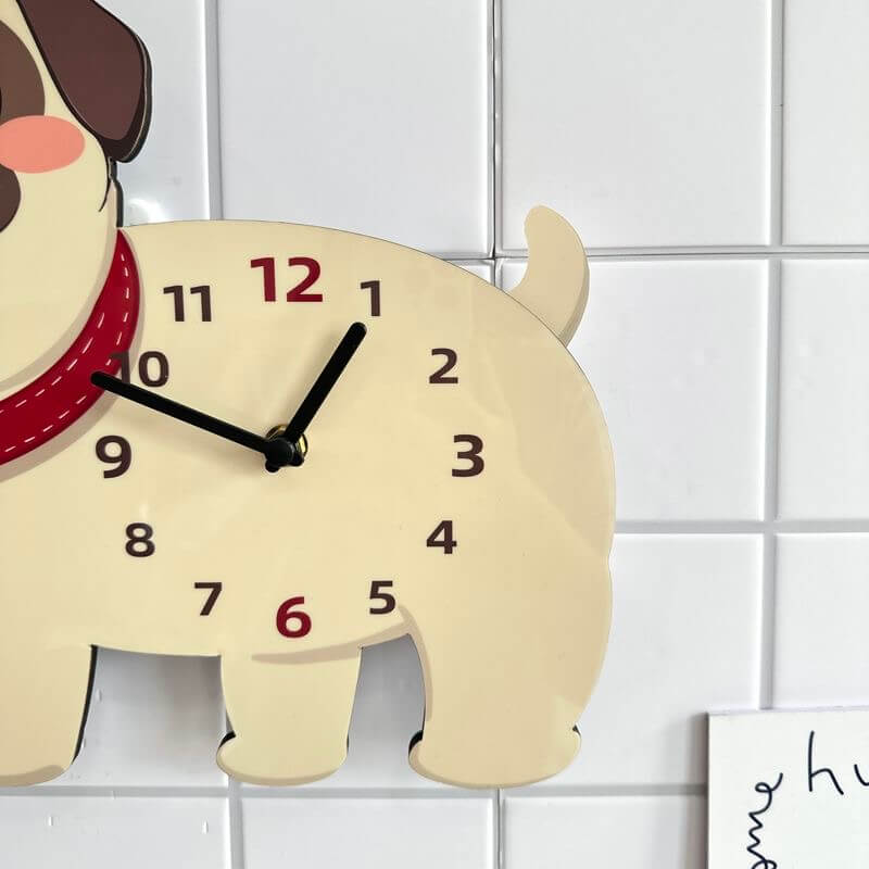 Pug carrot hat clock front view on white wall with green plant