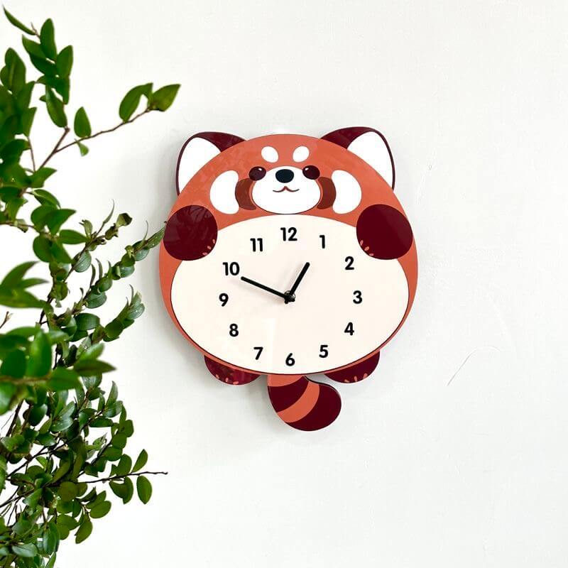 Red panda wall clock on white tile wall with potted plant - modern home decor