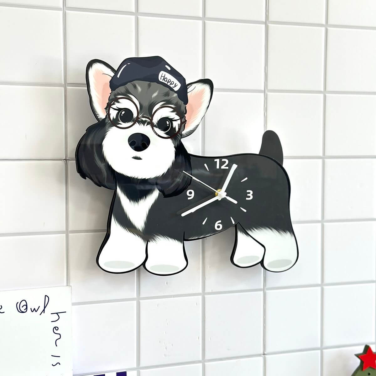 Schnauzer wall clock on white square tiles with decorative cards and star accents