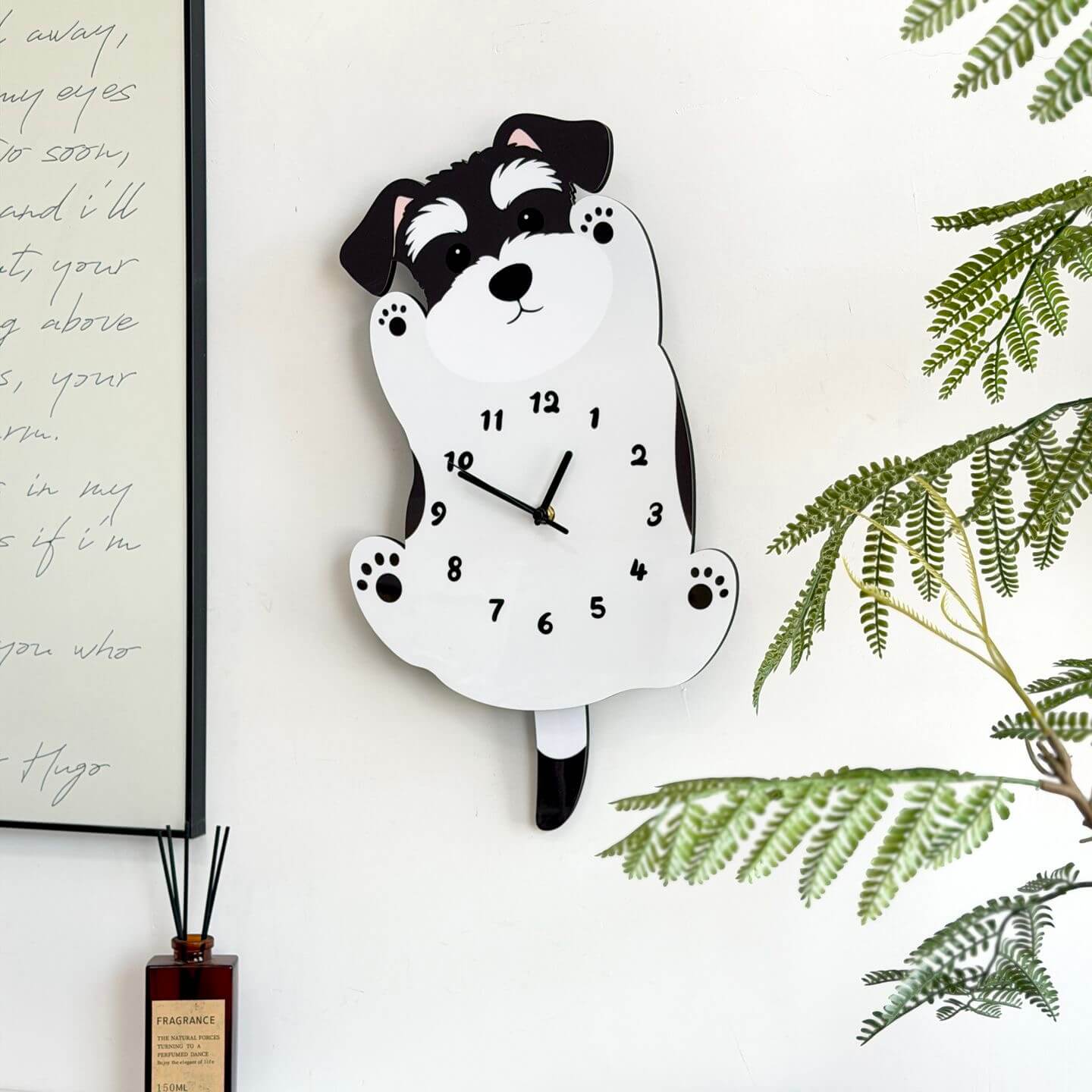 Schnauzer standing wall clock mounted on clean white wall with green plant decor